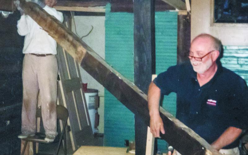 Glenn Eskew and Bill Clark work on the left side of the church’s renovation. (Contributed)