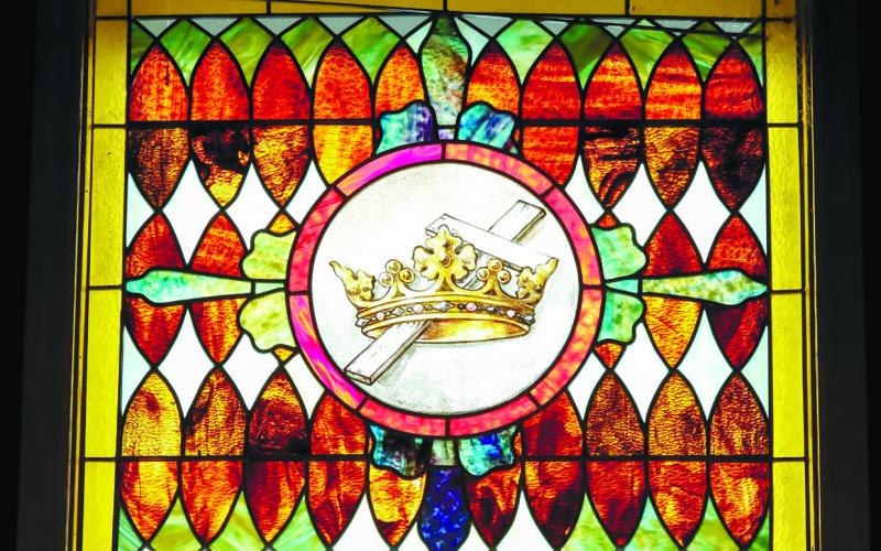 The stained glass window above the entrance to All Angels.