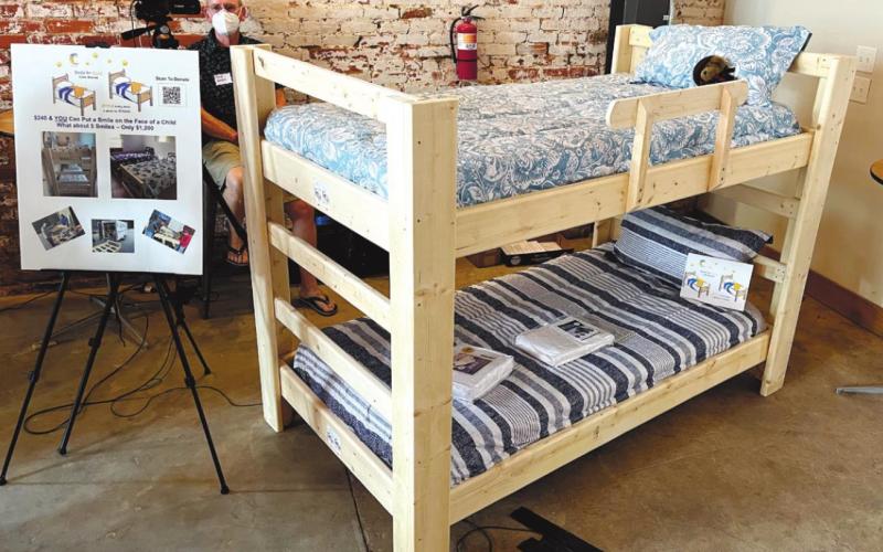 One of the group’s projects is to build and donate new beds, including pillows and sheets, to families whose children sleep on the floor or must share beds with other siblings. MARK ENGEL/Staff