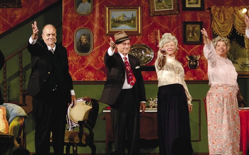 Actors (l-r) Michael Alexander, Arthur Shutt, Michael Homeier, Debbie McCown, Rusty Faulk and Drace Langford salute the crowd after presenting “Arsenic and Old Lace” Nov. 5 at Festival Hall in Greensboro.