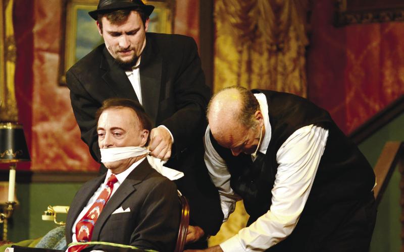 Mortimer Brewster (Homeier) is gagged and tied up by Dr. Einstein (Alexander) and Johnathan Brewster (Shutt) as they plot their next move.