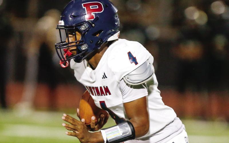 Putnam County junior quarterback Caleb Reeves had a big night for the War Eagles in their Aug. 28 win over Hancock Central. LANCE McCURLEY/Staff
