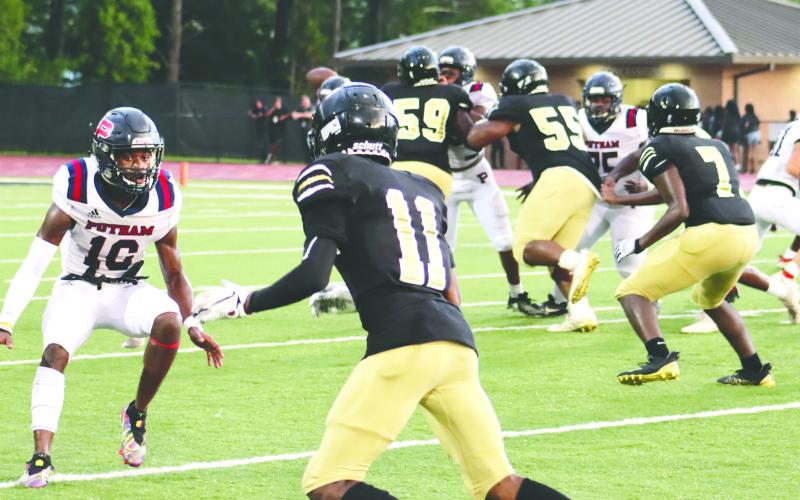 Putnam County cornerback Cory Foster (10) in coverage of former Greene County wide receiver Jaden Dorsey (11). BRENDAN KOERNER/Staff