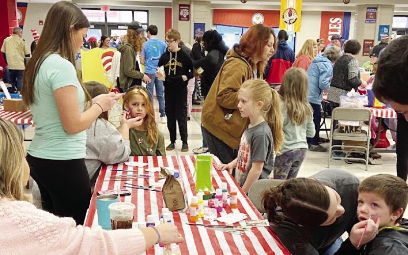 The cafeteria at PCES was transformed into Seuss Central last Saturday, with games and treats for nearly 100 local children. CONTRIBUTED