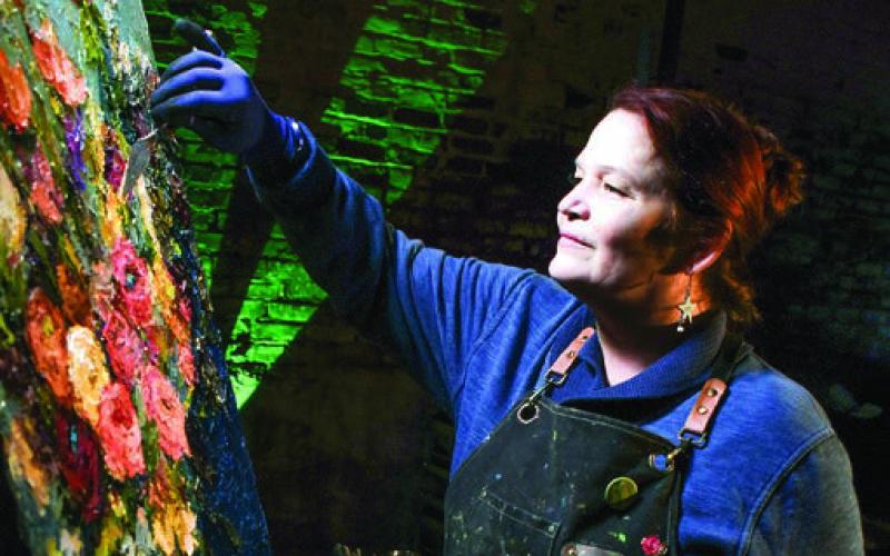 Noted artist Dawn Kinney Martin created an oil painting on site using her unique application of color using only a palette knife. Photos by IAN TOCHER/Staff