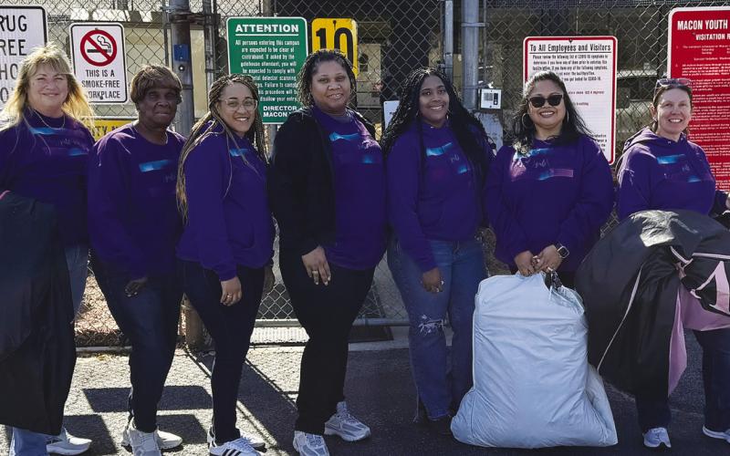 Reasha Daniels (third from right) and several other Putnam County women recently visited a youth detention center for girls in Macon to distribute dresses for a Valentine’s Day dance. CONTRIBUTED