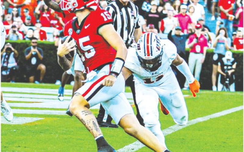 Georgia quarterback Carson Beck (15) easily finds the end zone on a 4-yard touchdown scramble against the Skyhawks. CHARLES JORDAN/Contributed