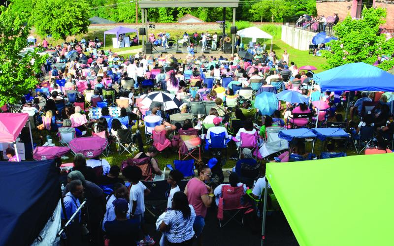 The mid-afternoon crowd probably gained another 150 fans by the time the sun set on Eatonton Saturday night.  (IAN TOCHER/Staff)