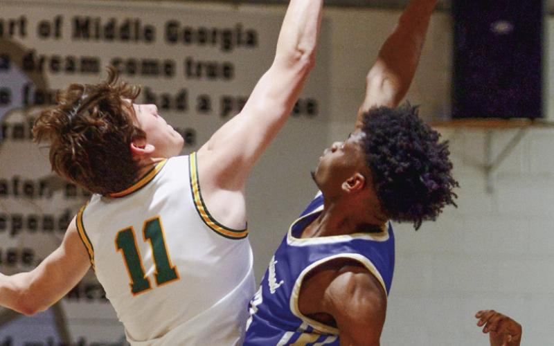 Jake Rich won the opening tipoff for the Gators against Brentwood. IAN TOCHER/Staff