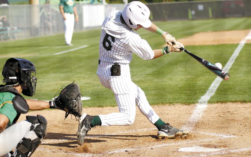 Gatewood’s Hunter Johnson connects at the plate in a game played earlier this season in Eatonton. TREY NORRIS/Staff