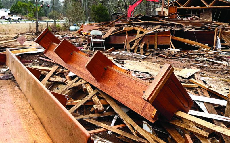 Church pews were among the debris left behind after the Rooty Creek church fell to the jaws of a demolition backhoe. IAN TOCHER/Staff