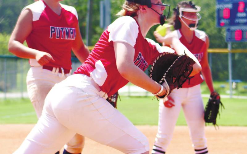 Junior Sammantha Spisak makes a throw to first for an out.