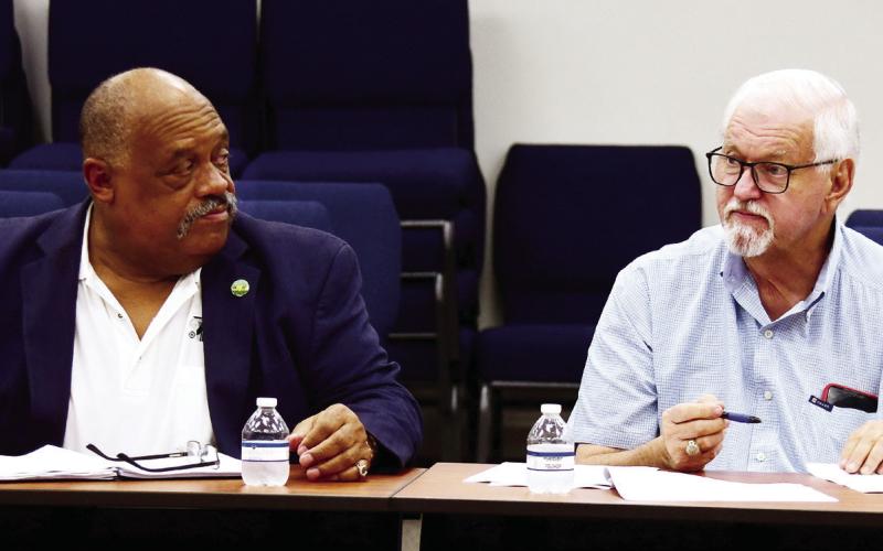 Eatonton Mayor John Reid (left) and Putnam County Commission Chairman Bill Sharp presided together last month over a meeting to determine a T-SPLOST funds distribution plan. IAN TOCHER/Staff