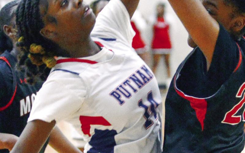 Junior Jaikarccie Smith plays defense against Morgan County. IAN TOCHER/Staff