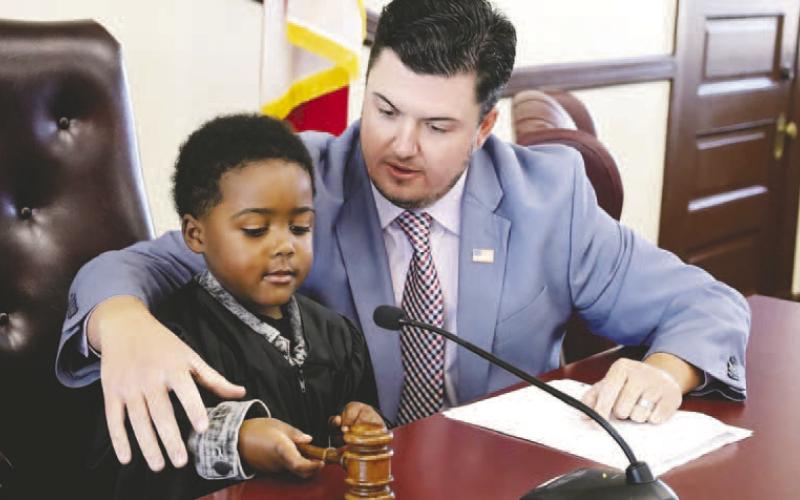 Addison explains the use of the gavel in the court process. IAN TOCHER/Staff