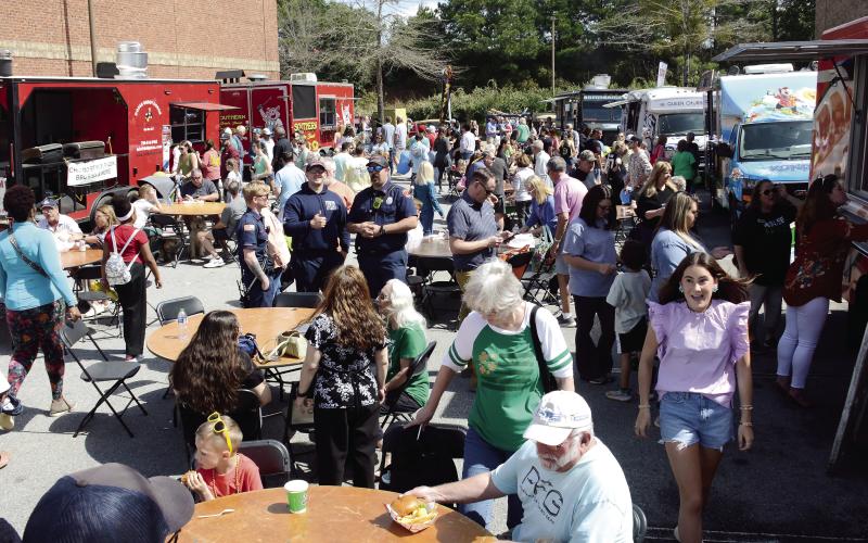 Long lines were the order of the day at several food trucks lined up near the entrance to The Big Event last Saturday at Lake Oconee Village. IAN TOCHER/Staff