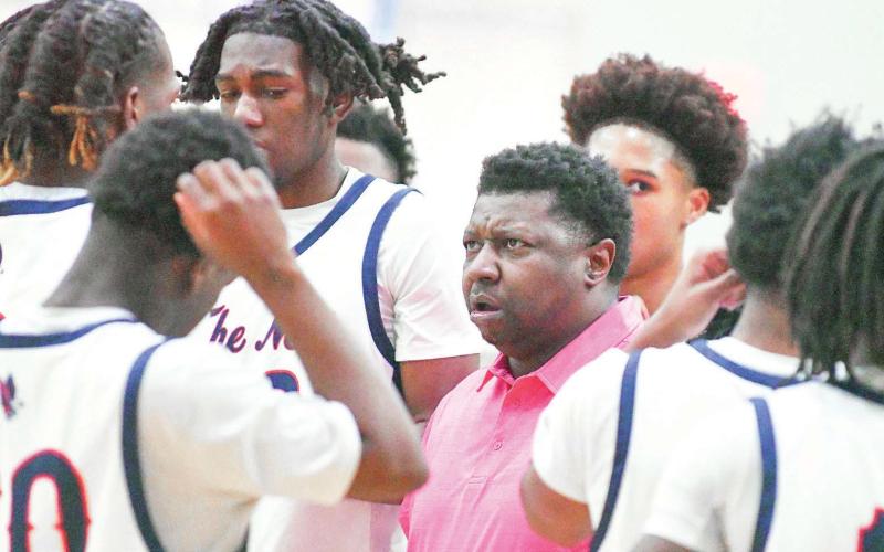 Putnam County coach Patrick Marshall talks with his team during a timeout in a game against Lamar County on Jan. 28. IAN TOCHER/Staff