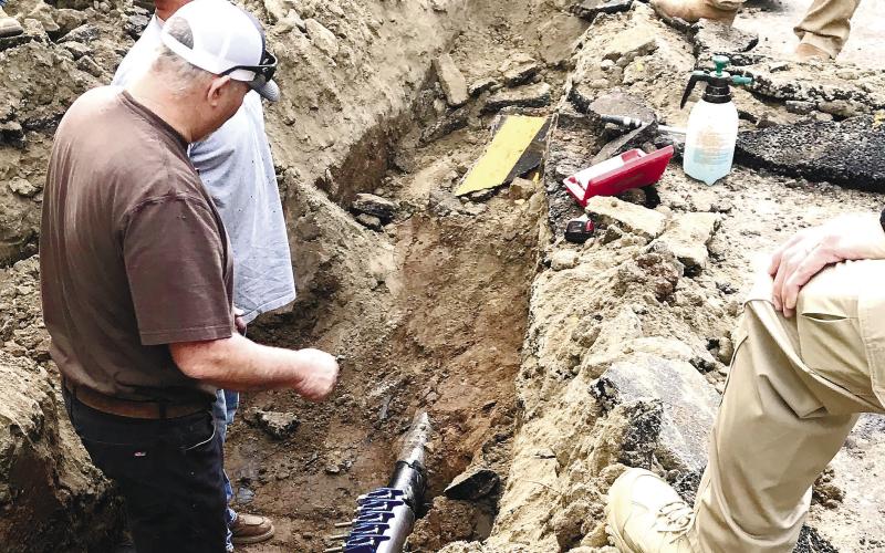 Colby Andrews and Jay Andrews with C&amp;amp;H Pipeline work on the repair of the four-inch gas main that was struck by a contractor. CONTRIBUTED