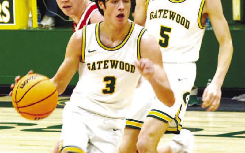 Gatewood sophomore Walker Roberts (3) makes a strong offensive move with the ball as his Gators teammate, Blake Callaway, follows the play. IAN TOCHER/Staff