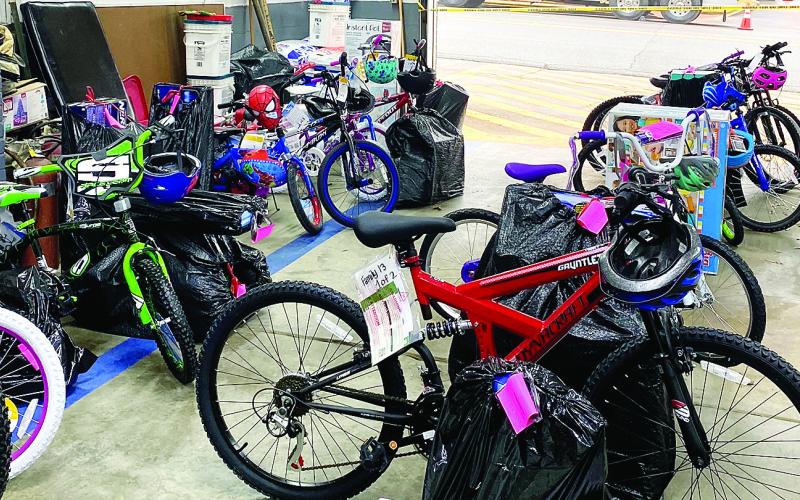 Last year’s Fireman Santa gifts for about 200 City of Eatonton kids nearly filled the garage area in the Eatonton Fire Department building on West Marion Street. EFD Chief Jamey Williamson said he hopes to deliver even more Christmas gifts to local kids this year. CONTRIBUTED
