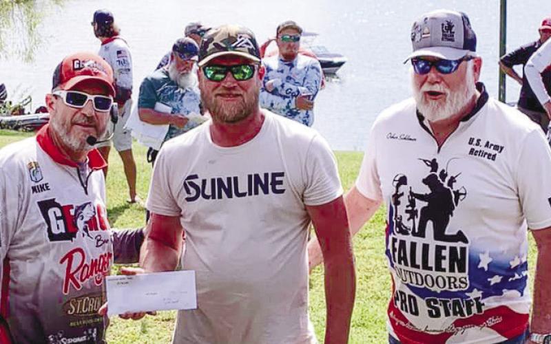 Mike Tarrer of Georgia Bass Trail along with tournament winner John Duvall and Oskar Schlomer of The Fallen Outdoor group. CONTRIBUTED