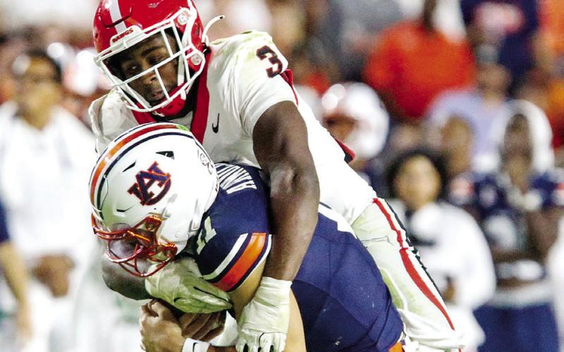 Georgia linebacker CJ Allen (3) sacks Auburn quarterback Jackson Arnold during the third quarter. LANCE McCURLEY/Staff