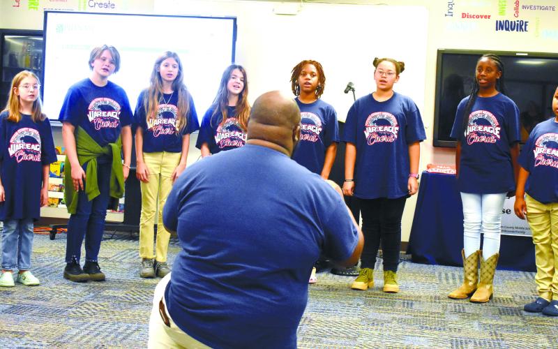 Chorus teacher Ontario Williams leads sixth grade chorus members in singing ‘Color of the Wind’ from the Disney movie Pocahontas.