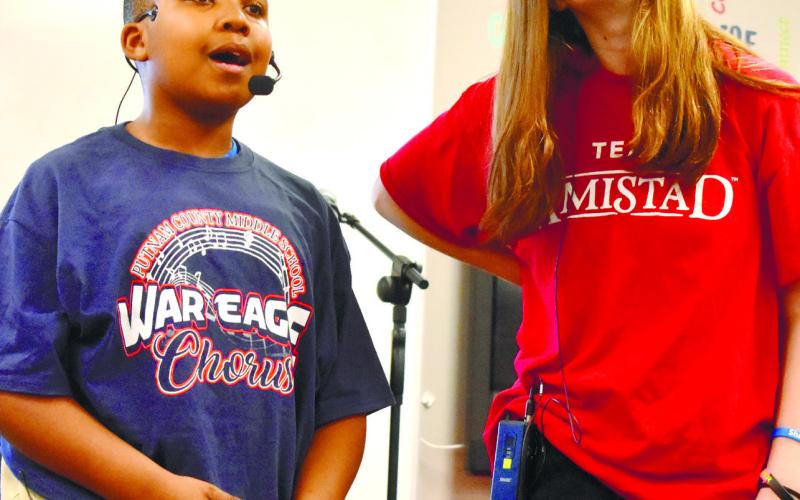 Charles Jones III and Peyton Stokes sing ‘There is a Santa Claus’ from Elf the Musical.