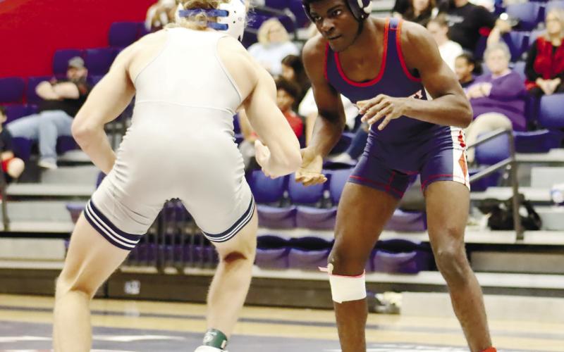 Putnam High’s Jonquail Coates (right) eyes up his opponent at the 2023 Region Championships.