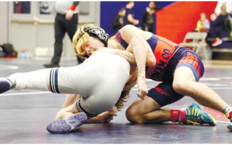 Senior Wyatt Stanley tries to pin an opponent during the 2023 Region 4-AA championships.