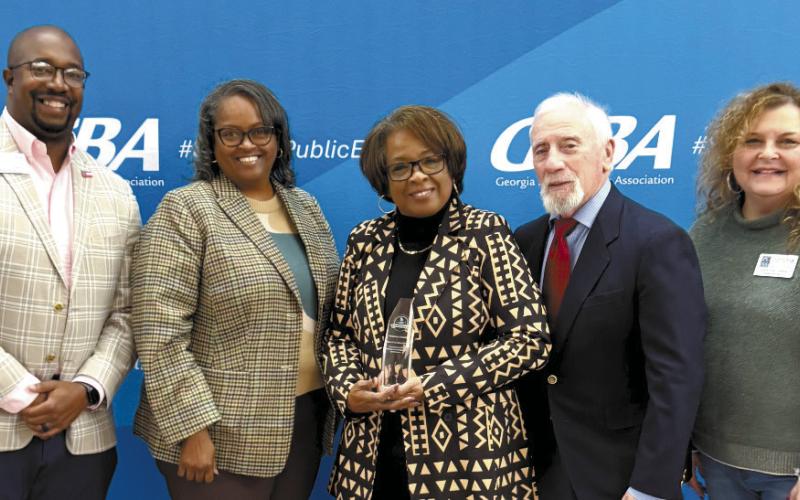 Putnam County Charter School System board members, including (l-r) Charles Trumbo, Simone Jones, Doris Clemons, Chairman Steve Weiner, and Vice Chair Carol Ann Guthrie display their 2025 Exemplary Board Recognition from the Georgia School Boards Association. CONTRIBUTED