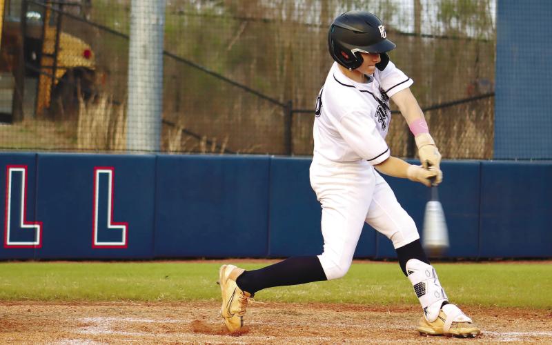 Gates Lanzarone (28) sends a single into left field. ARELLA CASH/Staff
