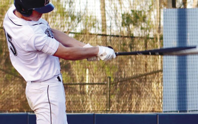 Dakota Jones (15) sends a single up the middle in game earlier this season. ARELLA CASH/Staff