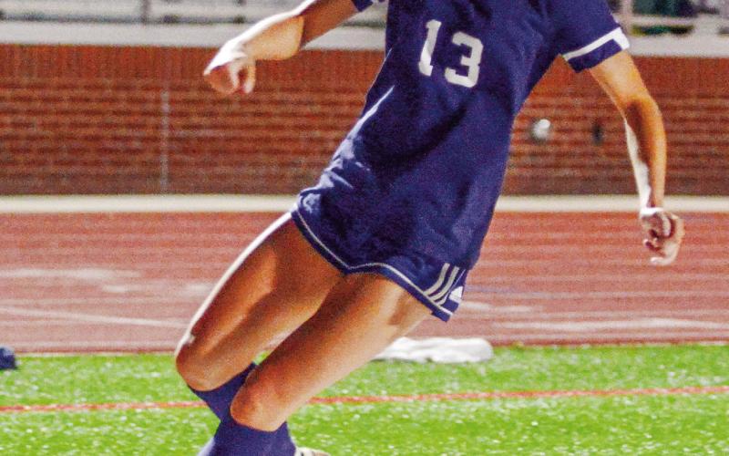 Alongside teammates Gracie Bird and Elizabeth Haley, Lily Frisch (13) is part of a three-pronged attack for the PCHS girls' soccer team. IAN TOCHER/Staff