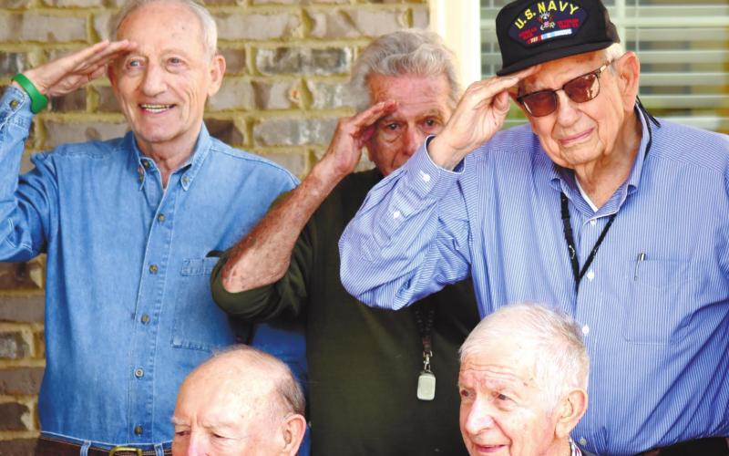 Smiling and giving a salute are, back row from left, Robert Landau, Robert Cooley, Joe Sam Rabun; front row from left, Bobby McElhannon and Clarence Thompson. LYNN HOBBS/ S t a ff