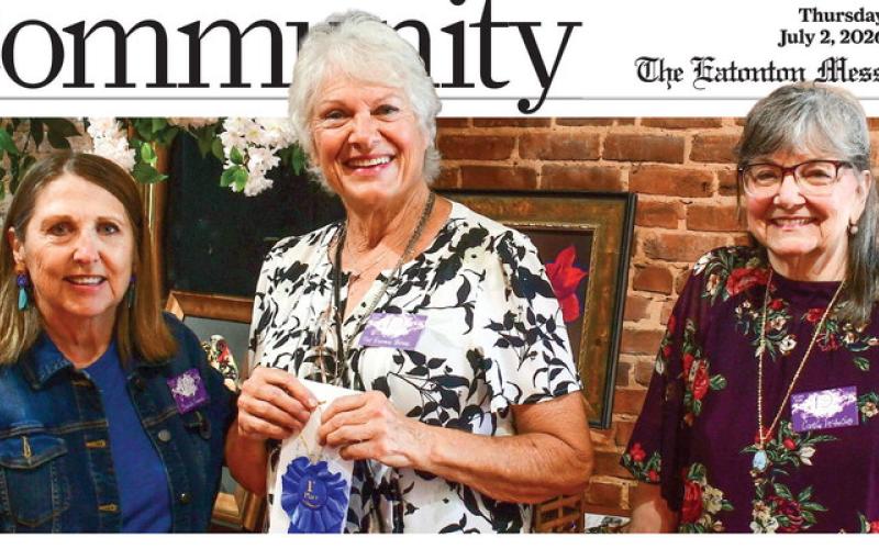 Artist Pat Devine Barnes (center) accepted the blue ribbon, signifying her first-place finish in the 10th annual Lake Country Juried Art Show, from show cochairs Michele Hartung (left) and Cathy McIntire.