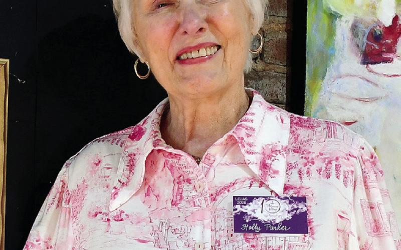 Artist Holly Parker received the prestigious People’s Choice Award for her painting Never, Never Lived, determined through votes by attendees during the show at Barrel 118.