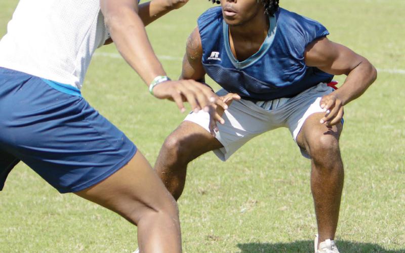 Putnam County senior safety Kaleb Lawrence gets into position during a spring practice in May.