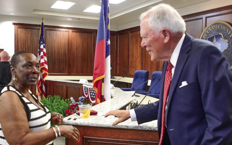 Eatonton First Lady Janie Reid, wife of Mayor John Reid, shared a moment with former Georgia Governor Nathan Deal at the conclusion of Saturday night’s “Voices and Votes” discussion in the meeting room of the Putnam County Annex. IAN TOCHER/Staff