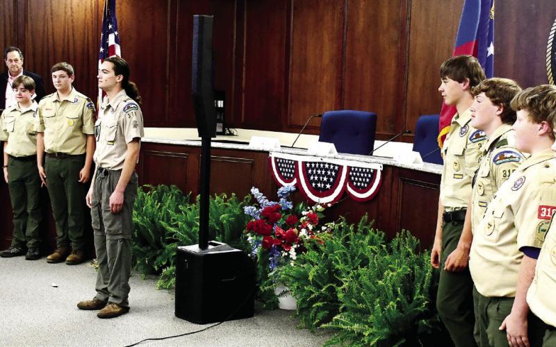 Local Eatonton-Putnam Boy Scouts served as the Color Guard for the “Voices and Votes” event on Saturday night at the county’s administration building. IAN TOCHER/Staff