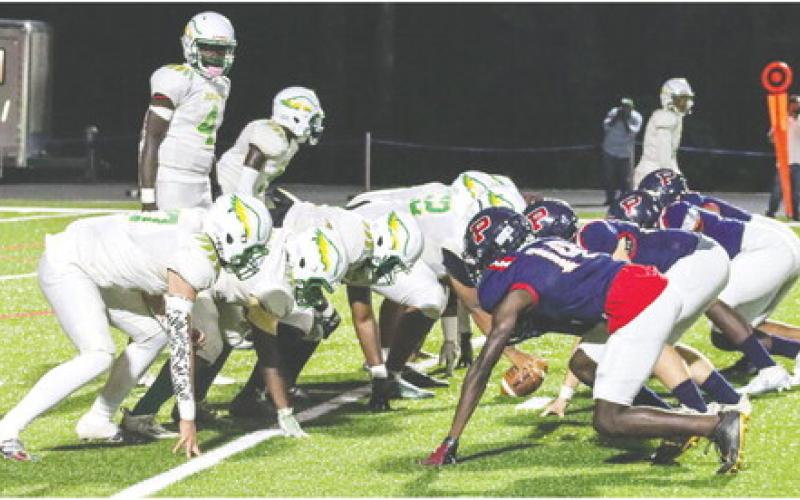 Josey quarterback Altravion Simpkins lines up the Eagles' offense against Putnam County in last year's game at Al Reaves Field in Eatonton. LANCE MCCURLEY/Staff