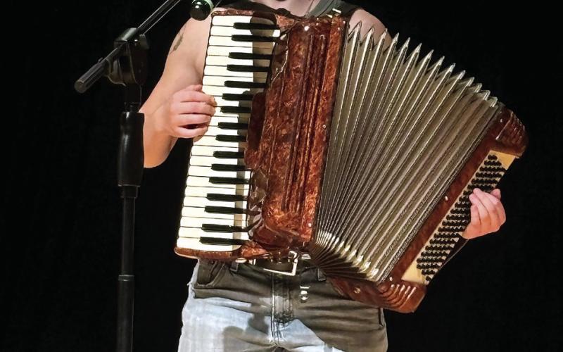 Anenaca Simpson sings and plays the accordion while performing “My Favorite Things” from The Sound of Music. EMME CLAUSE/Staff