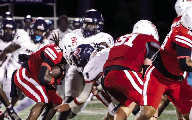 Social Circle running back Kayden Fears (31) fights his way through Putnam County defenders as he tries to score a touchdown. Courtesy of Brendan Koerner