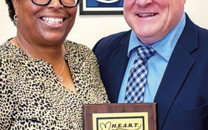 H.E.A.R.T Award recipient Tracy Surmelin poses alongside Assistant Superintendent Scott Sauls. “I am definitely one to say that I am Putnam Proud,” Surmelin said when accepting the award. ALIVIA BLANTON/Staff