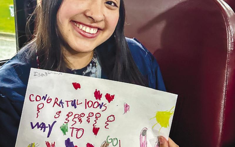 A Putnam County senior shows off the congratulatory art she received during her memory walk. CONTRIBUTED