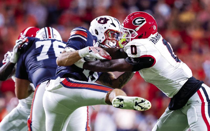 Georgia linebacker Gabe Harris (0) applies pressure in last year’s win over Auburn at Jordan-Hare Stadium. COURTESY OF UGA ATHLETICS
