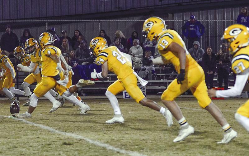 Gatewood kicker Jayden Daniel (4) leads the charge on Seniors Night at Sammons Field as the Gators start the second half against in-region rival Brentwood. IAN TOCHER/Staff