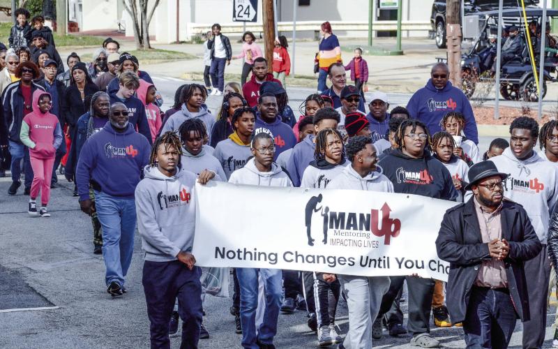 Approximately 150 local residents participated in a march Jan. 15 to acknowledge Martin Luther King Jr. Day with a march to and from the Putnam County Courthouse from Ebeneezer Baptist Church near downtown Eatonton. IAN TOCHER/Staff