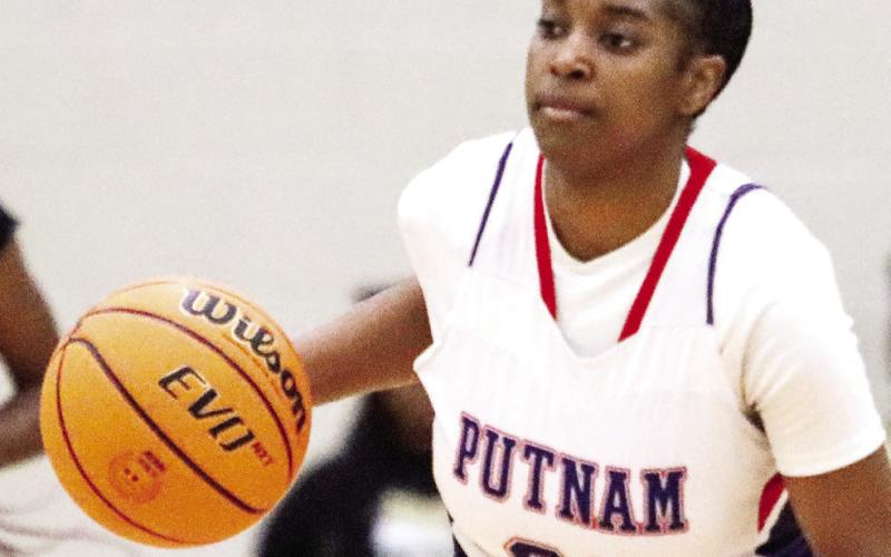 Putnam County senior Kamyra Aikens continued to prove her worth to the Lady War Eagles by becoming a thousand-point scorer while simultaneously playing a strong defensive game. LANCE McCURLEY/Staff