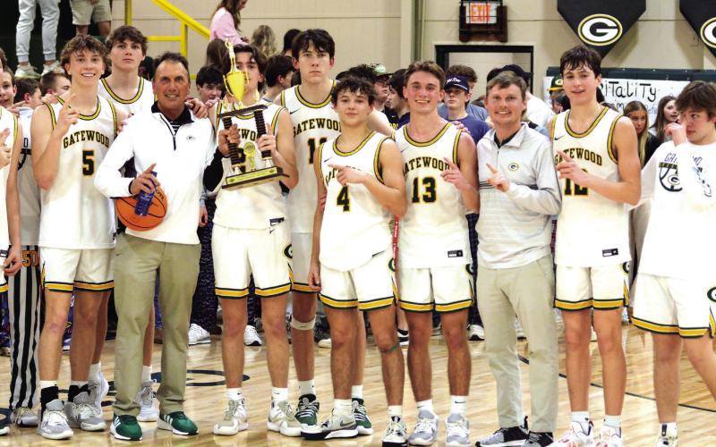 JT Gregory holds the trophy last spring signifying the Gatewood Gators as GIAA 2-AA regular-season champs for the second-straight year. IAN TOCHER/Staff